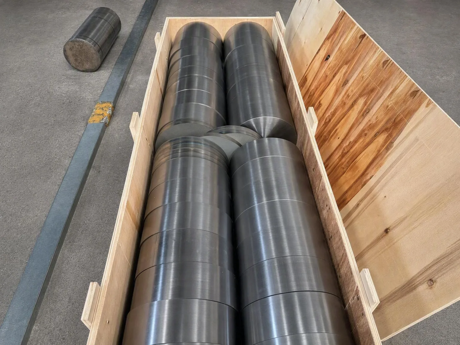 Machined cylindrical components in an open crate as generic product-release context
