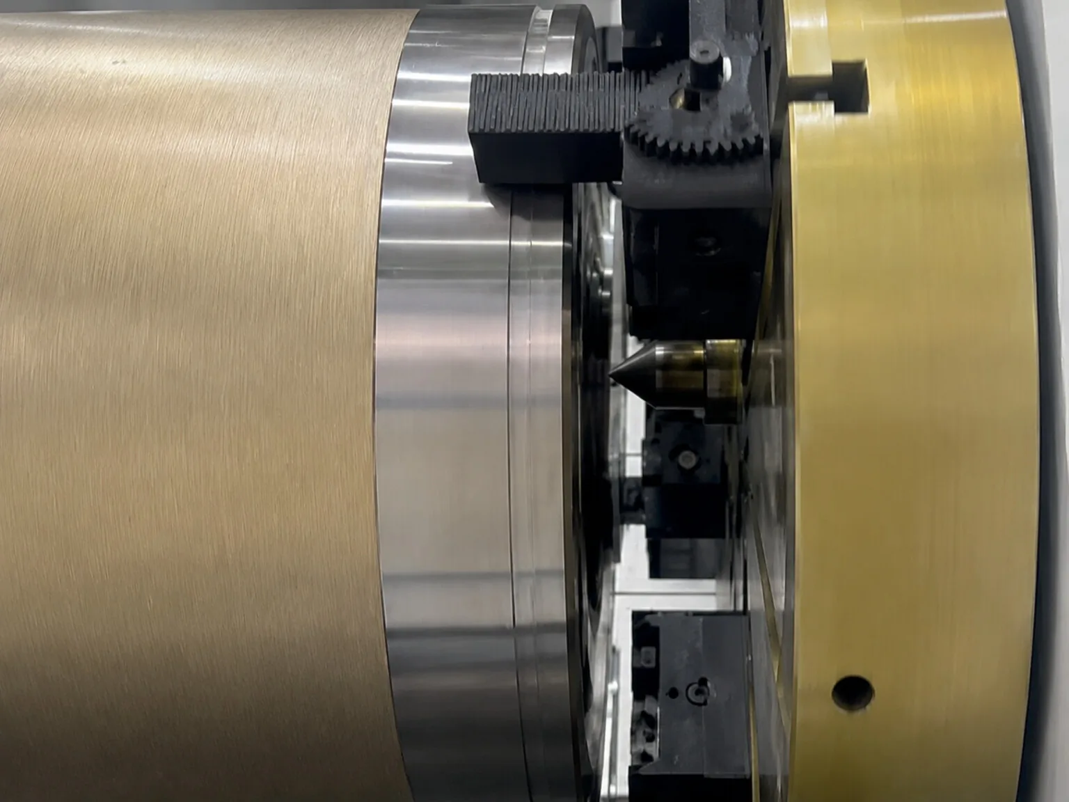 A user-supplied close view of industrial metal-processing equipment represents the need to control real process inputs; it is not the laser-welding cell or equipment used in the study.
