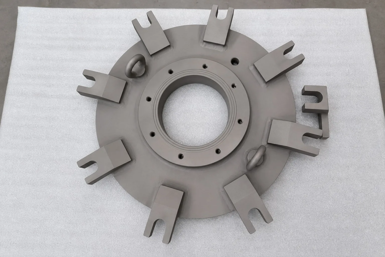 A user-supplied fabricated titanium component represents the kind of controlled three-dimensional geometry that must be verified before it becomes one phase of a hybrid structure; it is not the research specimen.