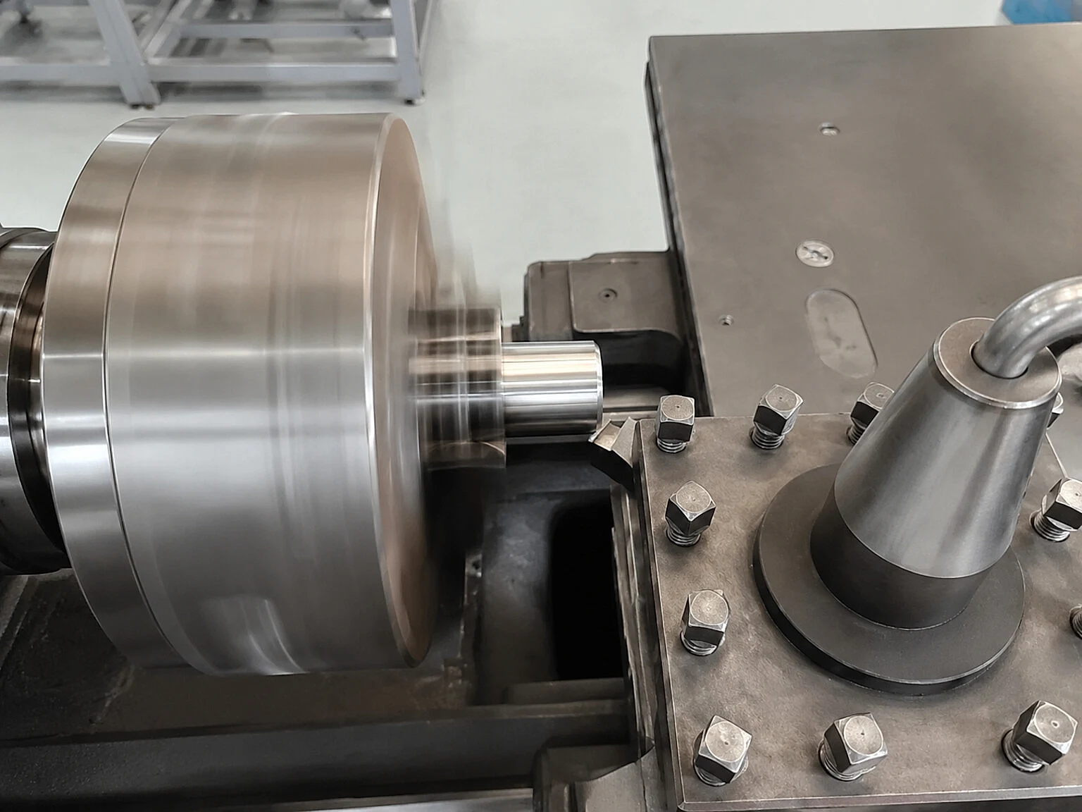 CNC machining of a titanium-like cylindrical part, emphasizing that post-processing evidence belongs in the final AM release package.