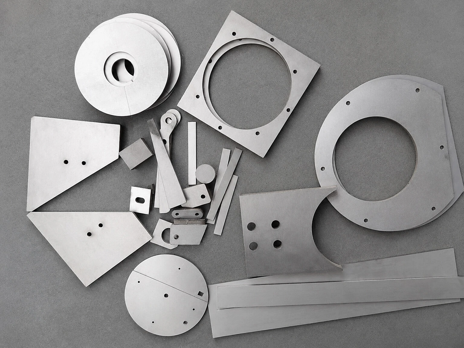 Machined titanium forms show how geometry and material distribution can become functional variables when a space structure must survive service but demise during re-entry