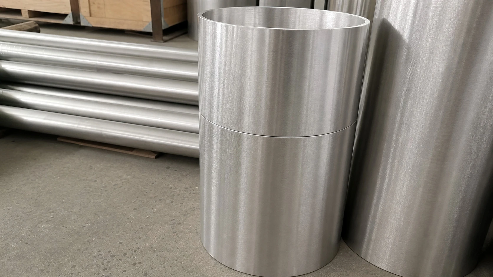 Close-up titanium pipe sections show that buyers need traceable release evidence for each product form, not only an upstream feedstock story.