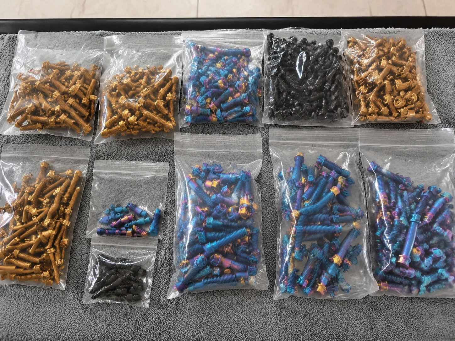 Titanium fastener sample bags arranged by finish and size, showing why each product family needs its own release evidence.