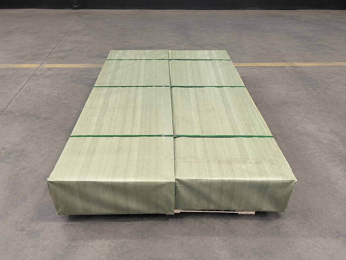 Packaged titanium or sheet-metal products on a pallet, reinforcing that strategic supply evidence has to travel with batch, packaging, shipment, and release documentation.